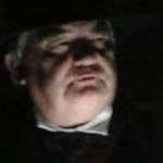 A shadowy face illuminated from below, telling a spooky story